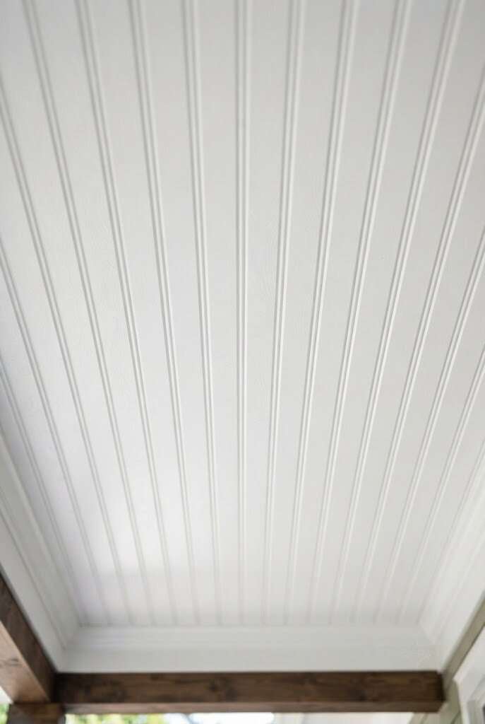 white beadboard paneling installed on a porch ceiling