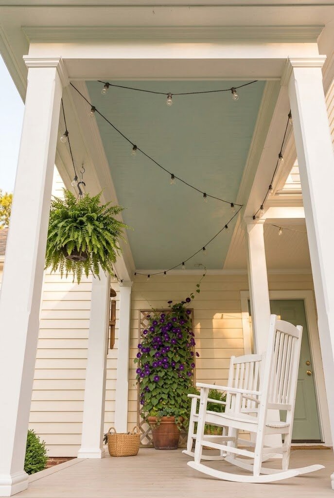 haint blue painted porch ceiling on Southern-style front porch with rocking chairs