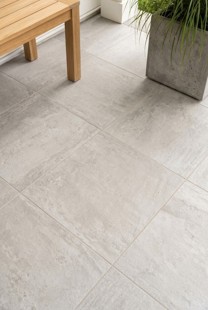 large format concrete look porcelain tile floor on modern front porch