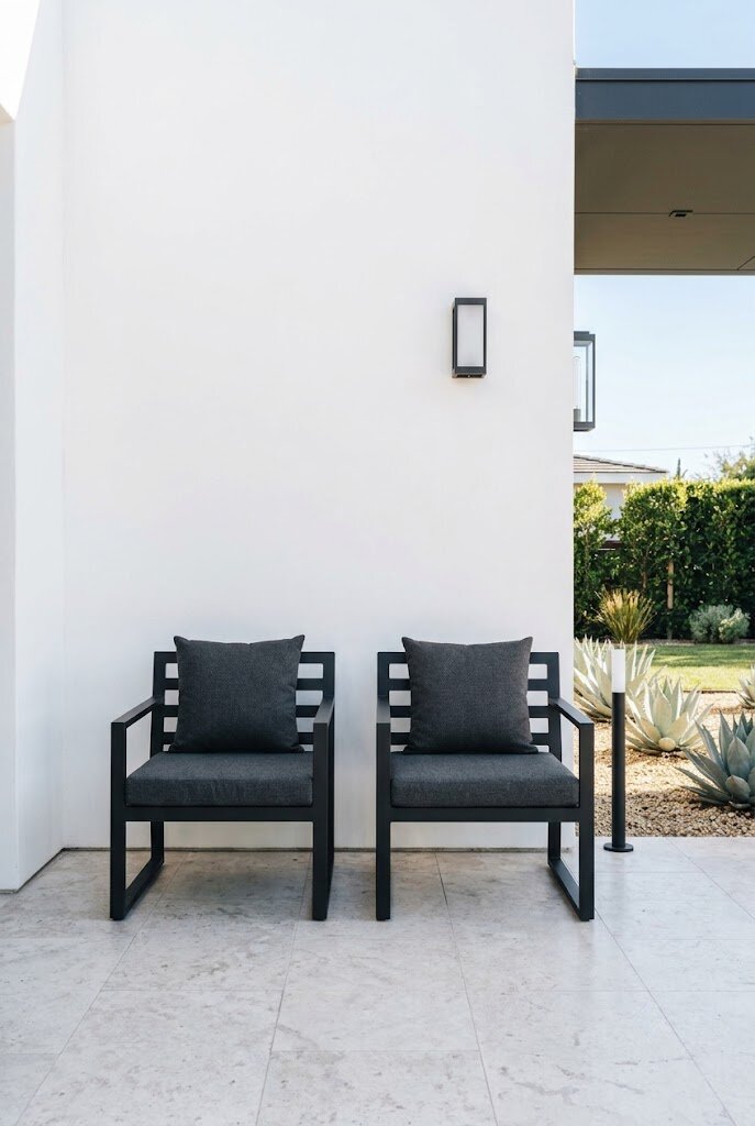 powder coated black aluminum outdoor chairs on modern front porch