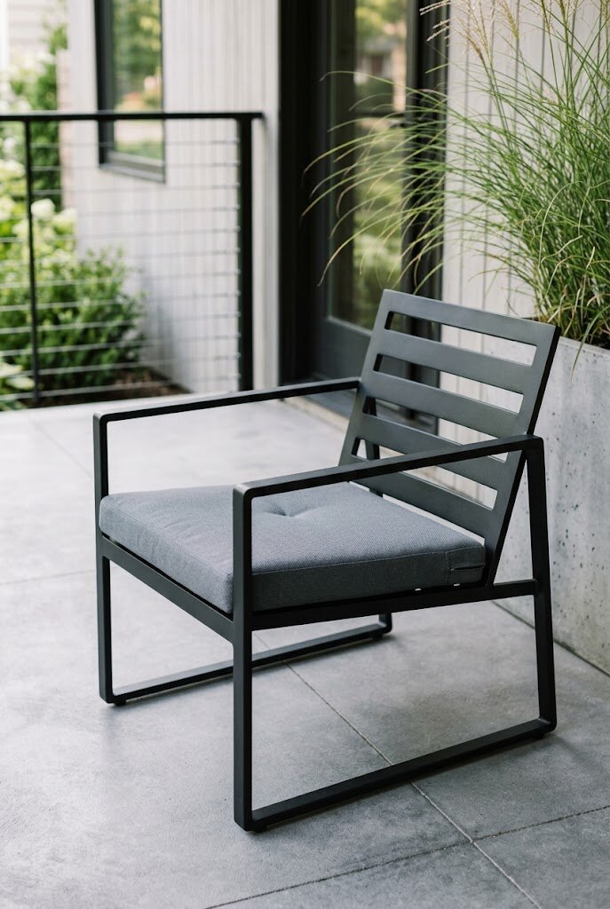 contemporary outdoor lounge chair with solid cushion on clean modern porch